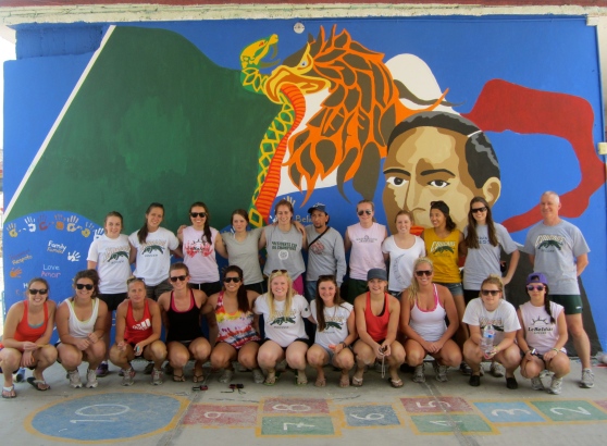The whole team with the first mural.